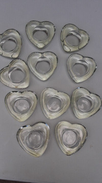 11 glass heart shaped holder for candles $20Used 1 time , like