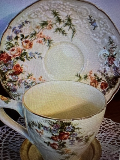 This Crown Ducal Florentine shape demitasse, Rosalie, features roses and ferns. The set’s whiteware...