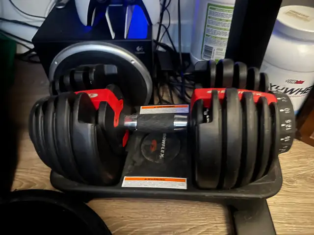 PAIR OF BOWFLEX ADJUSTABLE DUMBELLS.482731382004797440