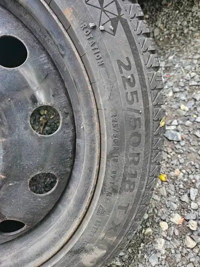A set of 4 winter tires on rims, used for 1 season.