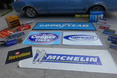 Up for sale are various Vintage Automotive Advertising Signs,Tire Stands, Cabinets, Catalogue stands...
