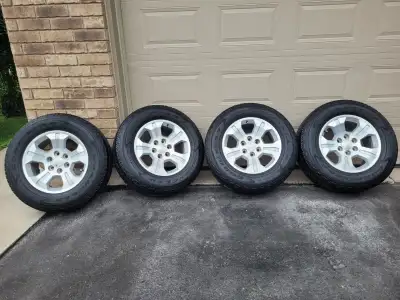 4-18 "Aluminum rims with Goodyear Wrangler Fortitude HT tires 265/65R18 with 8/32 tread remaining ....