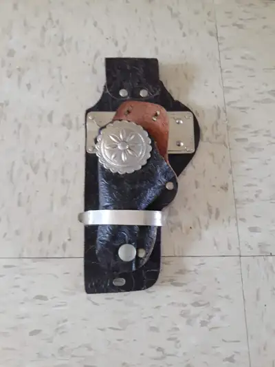 A vintage 50s leather gun holster with metal accents - marked Roy Rogers - good original condition -...