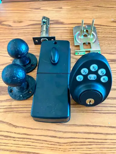 Black keyless entry door lock with electronic keypad. Perfect for a front door, side door, or rental...