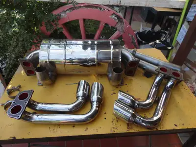 Exhaust silencer Tubi style for Ferrari 360, original, used. The center silencer is slightly dented...