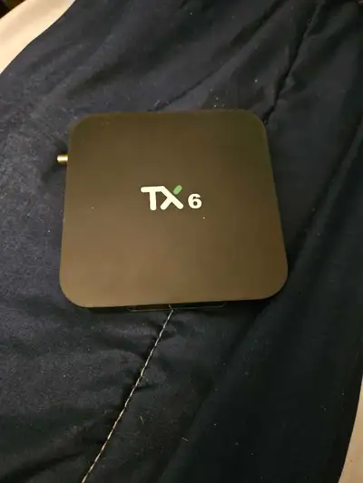 Android TV box. Turns a dumb TV into a smart TV. Access to play store, Netflix, prime, Disney +, etc...