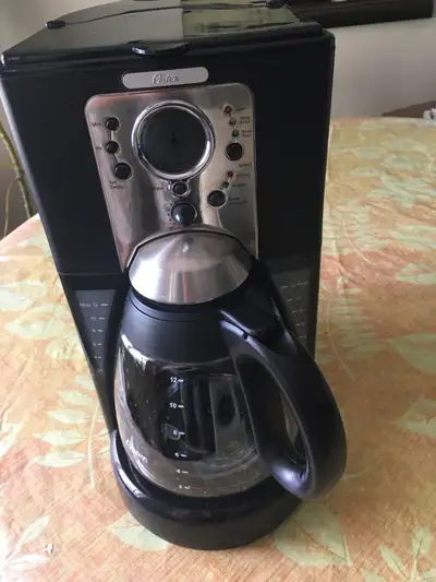 For Sale is a Slightly Used Oster 12-Cup Programmable Coffee Maker Model Number with the following f...