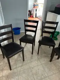 Kitchen table and three chairs plus bench 