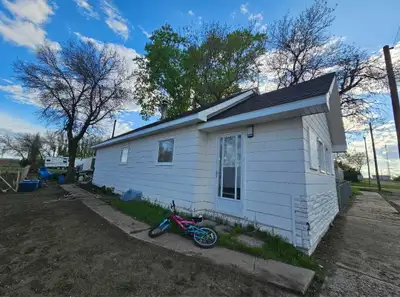 House and shop located in Hazlet Sk. House is attached to an additional lot with a 20X50 garden lot....