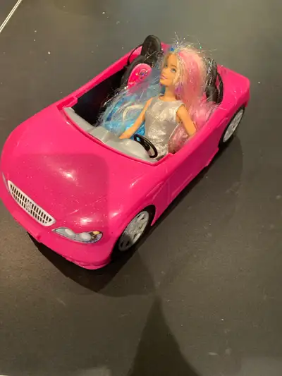Zoom into Barbie adventures with this vibrant pink Barbie car! This fun, used toy is perfect for ima...