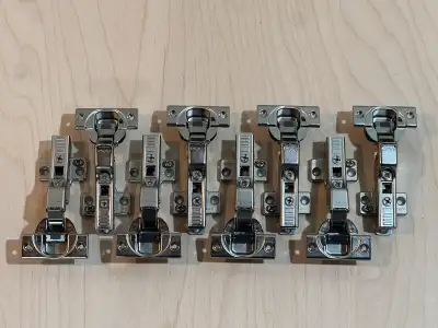 8 brand new Blum 110 degree hinges full overlay. Part number 71B355 Comes complete with mounting pla...