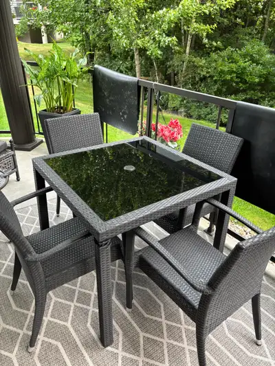 This patio table with four chairs is perfect for enjoying your outdoor space. The set features a squ...