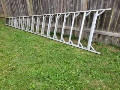 16 ft heavy duty aluminum step ladder. Good condition. Weathered due to outdoor storage but works we...