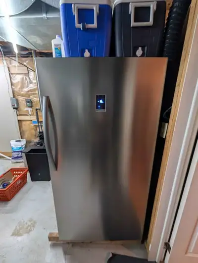 Selling our Insignia 17 cu. ft. upright convertible freezer. It's been running in our basement witho...