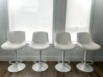 Selling a set of 4 modern white barstools, only used for 8 months. They’re comfortable, stylish, and...