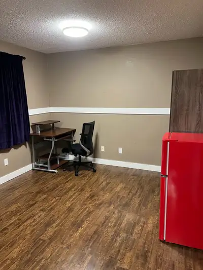 A large furnished double size bedroom with personally refrigerator in the room for rent in lower sui...