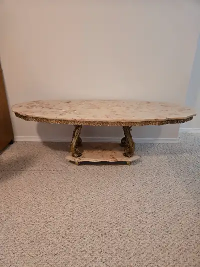 Marble coffee table 60"x24"; two matching marble end tables each 24" diameter; 2 matching lamps; 2 m...