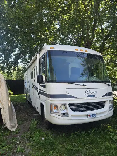 30ft motorhome with double sideouts features queen bed, generator, 2AC units, furnace, sleeps 6+ and...