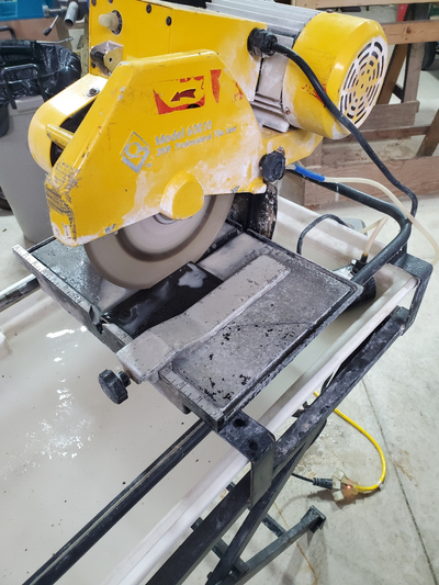 Wet tile saw on stand with extra blades, View more
