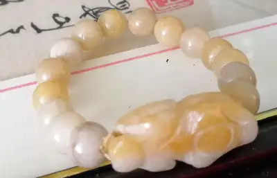 Chinese natural yellow jadeite beads and pique bracelet, View more