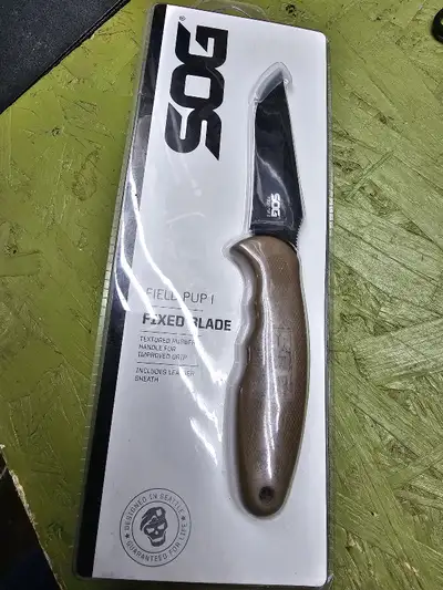 New in package SOG Field Pup 1 The Field Pup is a beautiful knife with a TiNi finish, typically foun...