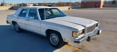 Take a trip down memory lane with this classic 1987 Mercury Grand Marquis LS, with a 5.0L EFI engine...