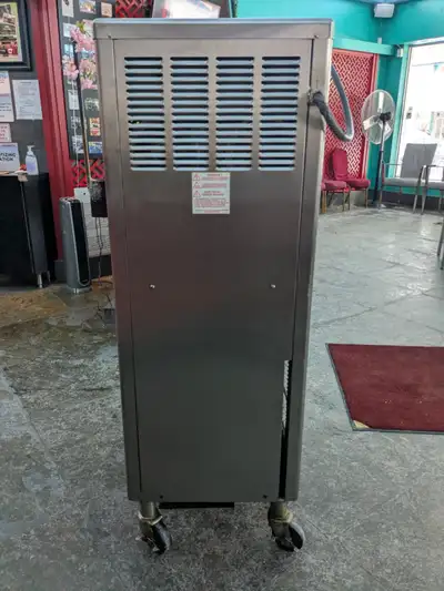 used frozen yogurt machine, a brand of Taylor, well maintained and efficient, clean and looking good...
