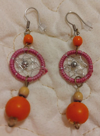Handmade pink dreamcatcher earrings with orange beads