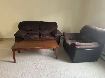 Living room 2-piece couch/sofa set with wooden table available. Very comfortable seating for relaxin...