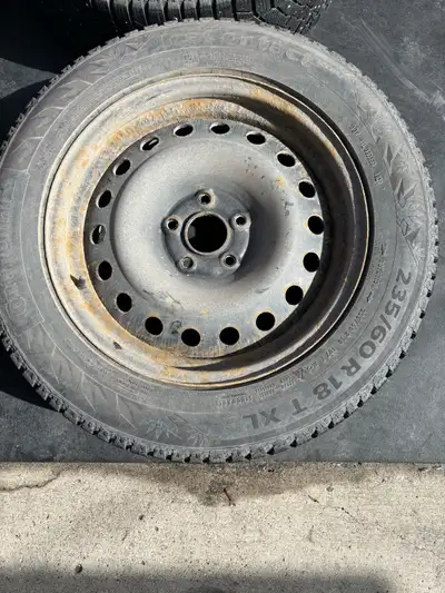 I'm selling a set of four used Continental Ice Contact winter tires, size 235/60R18, complete with s...