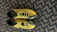 Yellow and black Puma soccer/football cleats, size 10