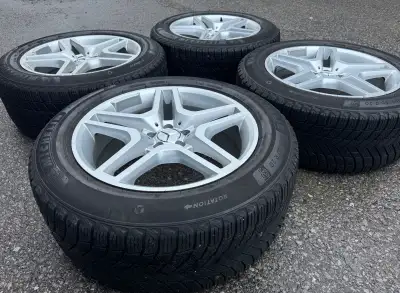 For sale is a set of four Michelin X-Ice Snow SUV Winter Tires mounted on silver Replica MB wheels w...