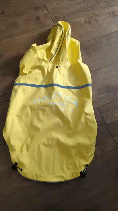 I am selling two used dog harnesses and dog raincoat. Large yellow Nautica rain coat in brand new co...