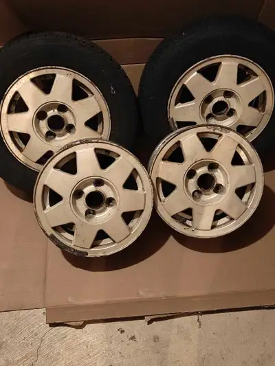 4 13" 4-bolt VW aluminum rims. 2 with decent Motomaster tires(P175/70 R13) $200. Available at the be...
