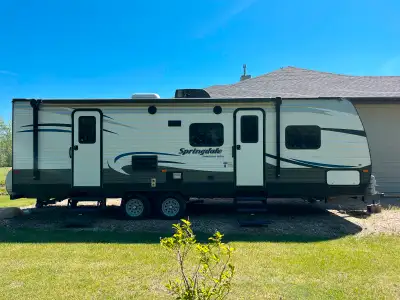 Double sized bunks beds and queen bed, 1 slide, half-ton towable, air conditioning, power awning wit...