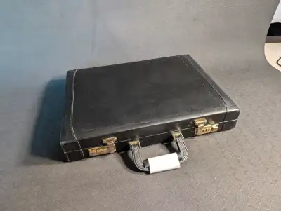 Helping parents condense their belongings. Old National Luggage Briefcase that has seen use but coul...