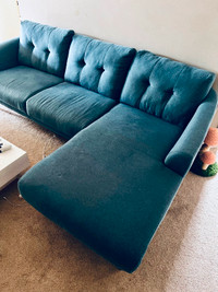 Blue fabric sectional couch with removable legs