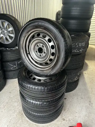 Set of four 205/55r16 91H Yokohama AVID Ascend all season tires on OEM factory Mazda wheels (wheels...