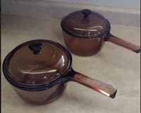 Vision Ware cookware in amber or cranberry colour