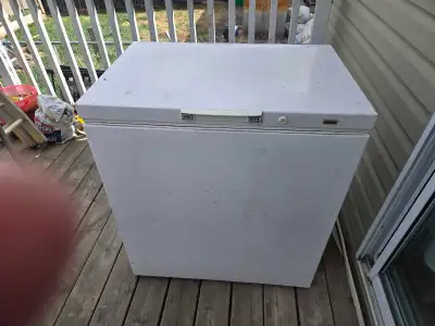 This is a used chest freezer with a spacious interior, perfect for storing extra food items. It's in...