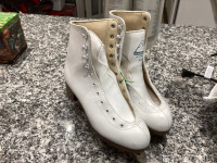 Ladies figure skates size 8.   In new condition