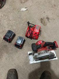 Milwaukee 6 1/2 circular saw with battery s and charger