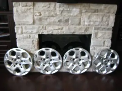 Set of 4 Ford 2010 to 2012 Ford Fusion 17" Plastic Wheel Covers in decent shape. These plastic cover...