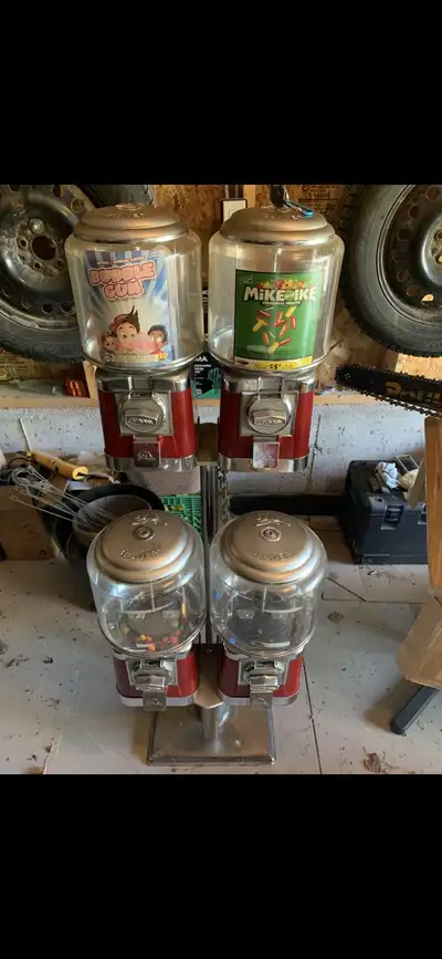I'm selling a set of four vintage Beaver brand gumball machines, perfect for adding a touch of nosta...