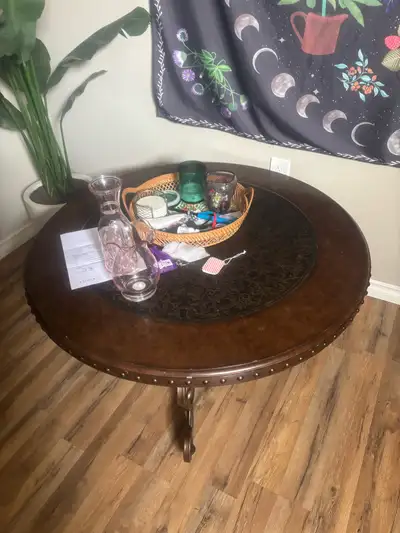 Has mark on top,metal and wood table. good for garage or camp.