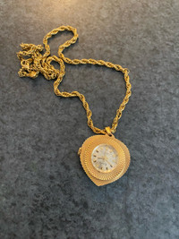 Vintage Hamlin winding Swiss made pendant watch with chain.