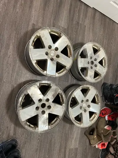 Selling a set of four factory 18-inch wheels that originally came off a Jeep Wrangler. These are use...