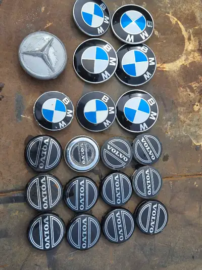 I am offering a collection of used hood emblems and wheel caps from BMW, Mercedes-Benz, and Volvo. T...