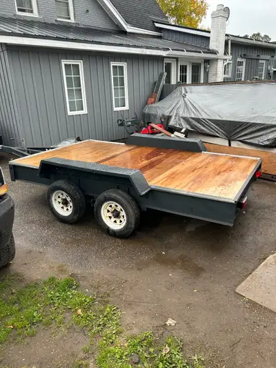 12x77 1/2 tandem utility trailer with new hitch coupler and new plywood also lights. Was sanded and...