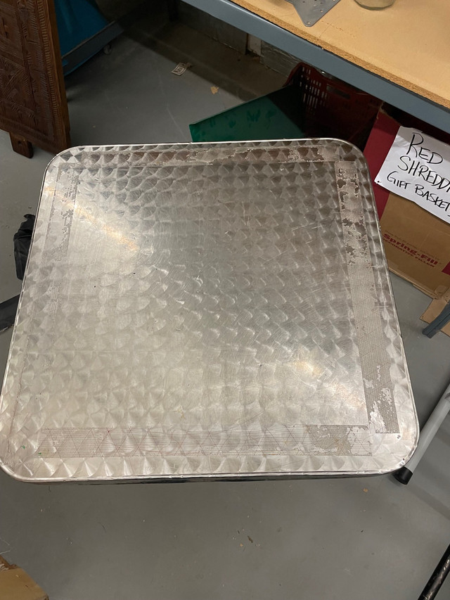 Stainless steel table top w/cast iron base. 2’.3” square 29.5”H in Other Tables in North Bay - Image 3